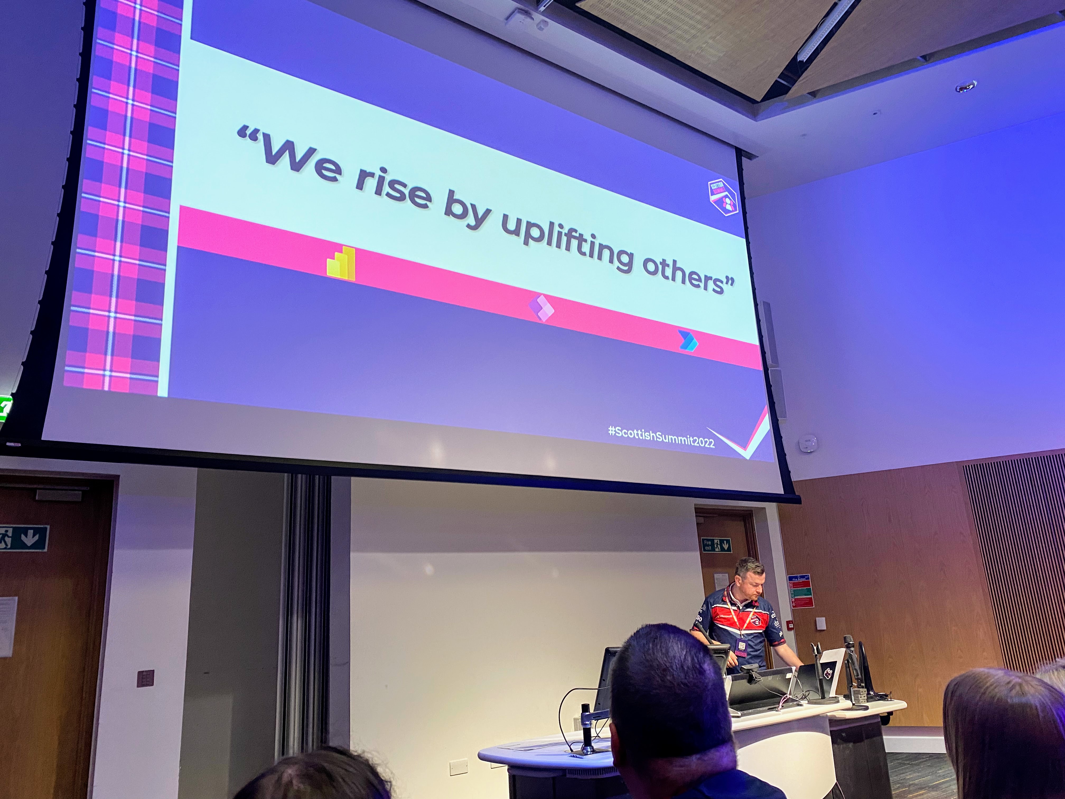Connell McGinley giving the keynote session at Scottish Summit 2022 saying we rise by uplifting others